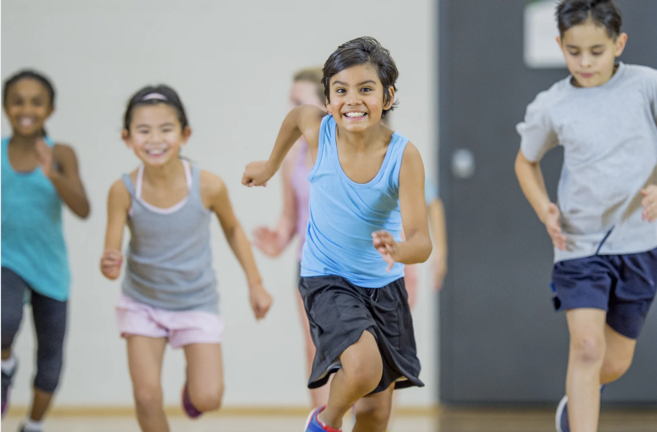kids running in a gym