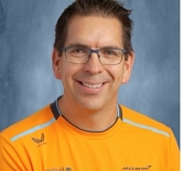 Photo of Bryan wearing an Orange McLaren shirt. 