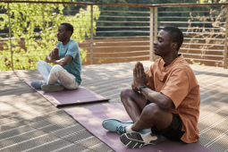 two people doing yoga