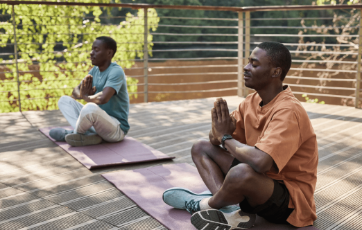 two people doing yoga
